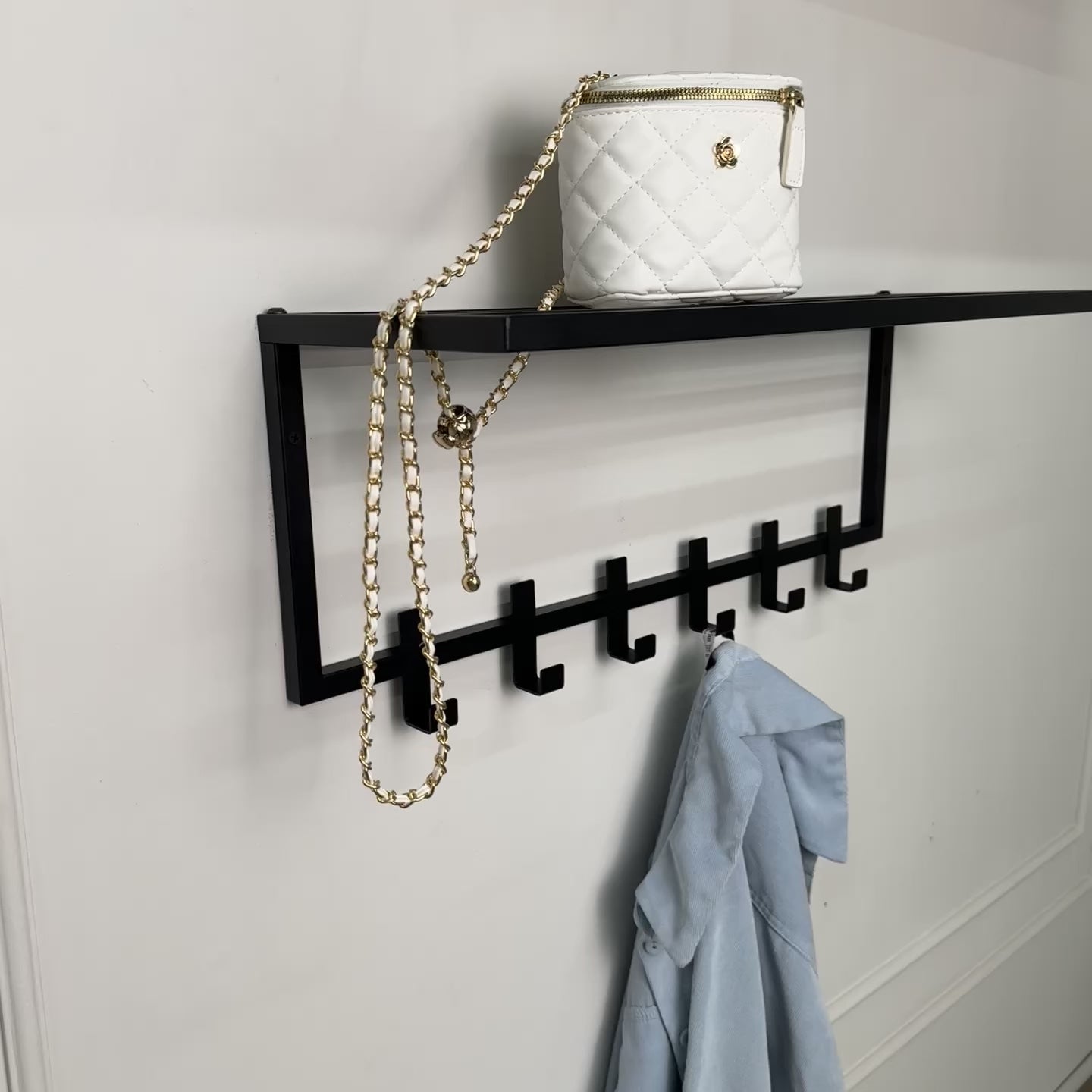 Collapsible metal coat hanger with hooks and shelf